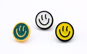 Broches smiley geel